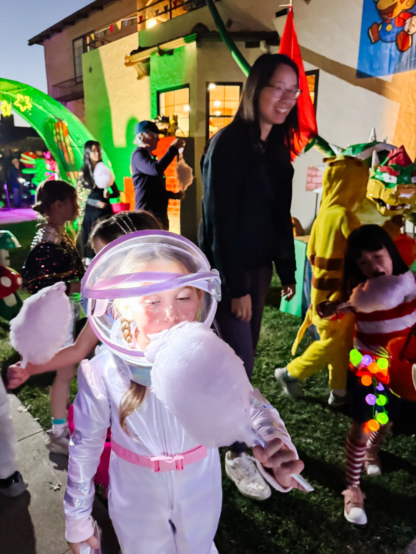 Astronaut costume at a Halloween event at night