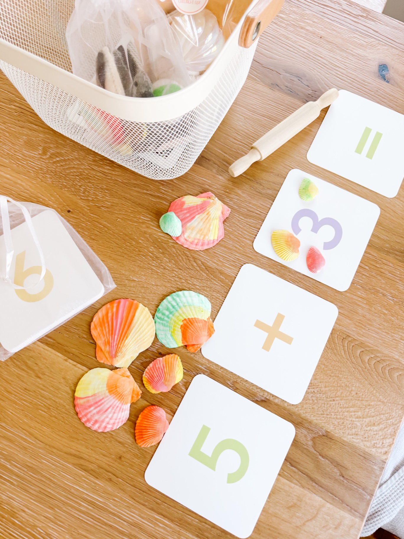 Morning basket activities laid out on a wooden table