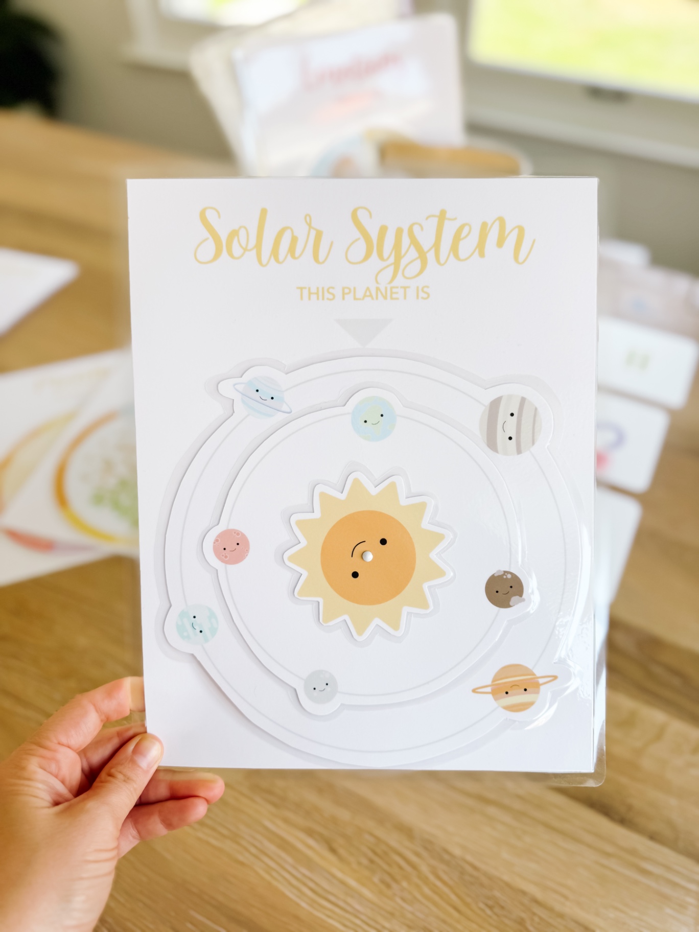 Solar system spinner activity sheet with a smiling sun and eight planets